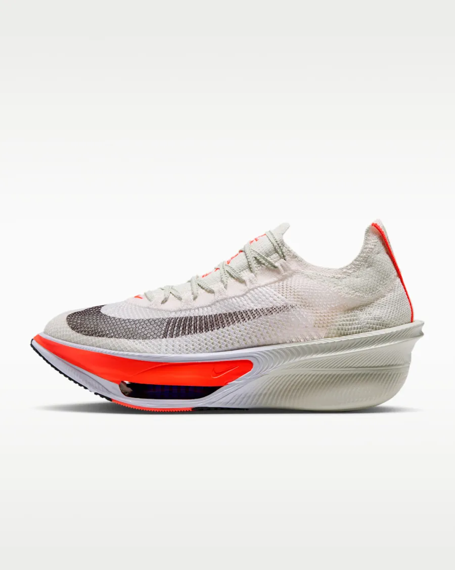 Side view of the white Nike Alphafly 4 with an orange-red forefoot Air Zoom unit