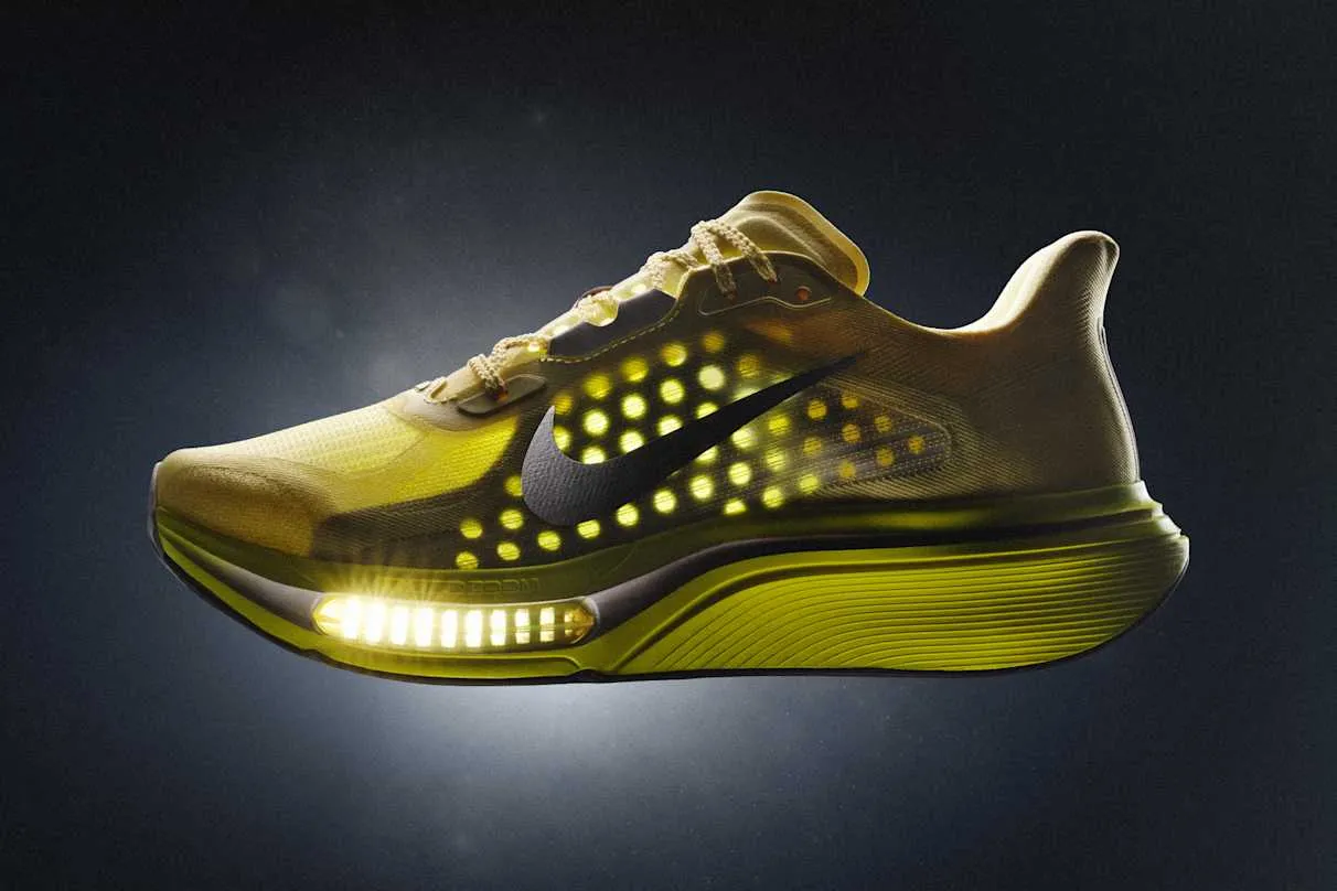 Glowing yellow Nike Pegasus Plus 2 showing its exposed forefoot Air Zoom unit