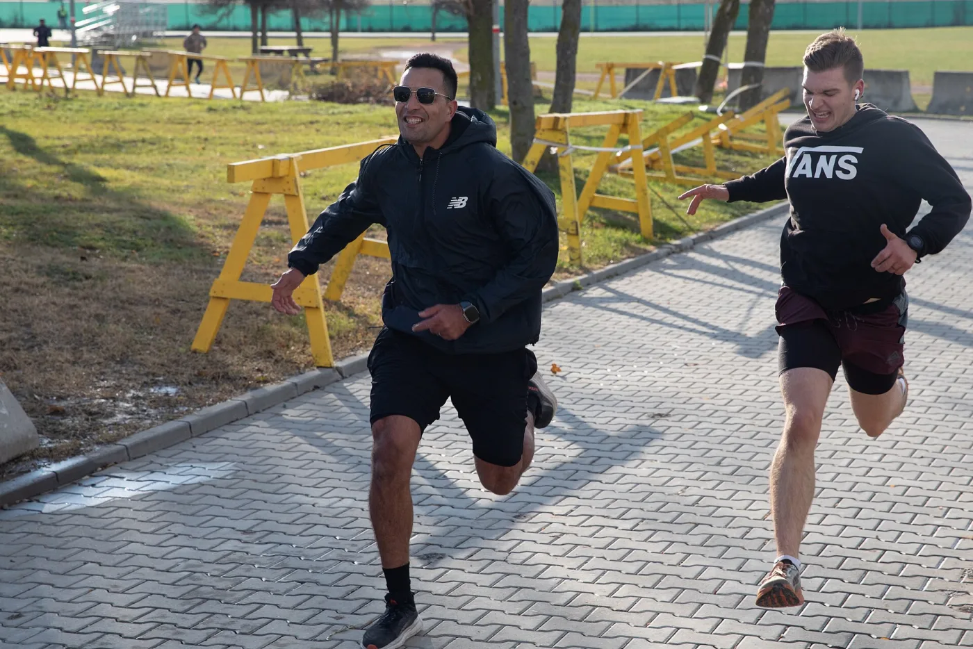 Runners sprint toward the finish line at a turkey trot race